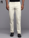 A pair of off white, solid patterned cotton pants with a smart fit designed for formal wear.
