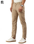Beige pants worn by a person on a white background